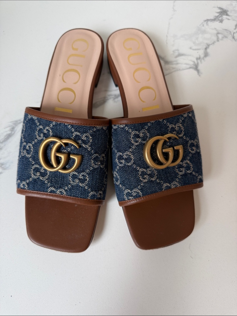 Then Gucci Denim GG Logo Slide Mules with Brown Leather Trim